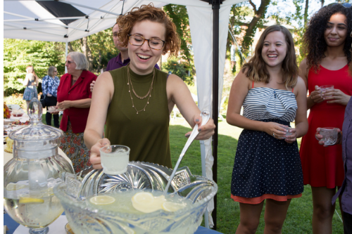 Student serving lemonade.